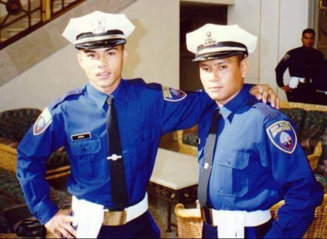 A young Peter J. Santos in Guam Police Department dress uniform with a fellow officer